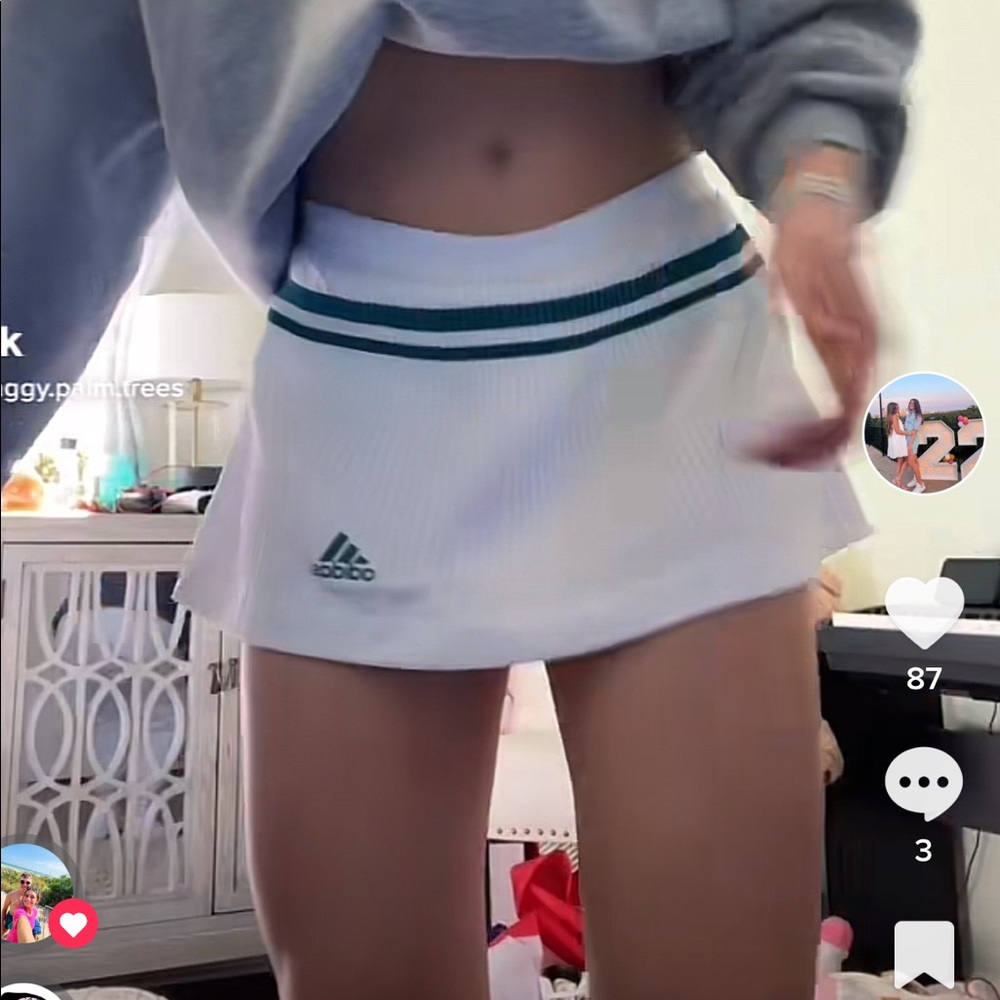 Adidas white tennis skirt with two green stripes